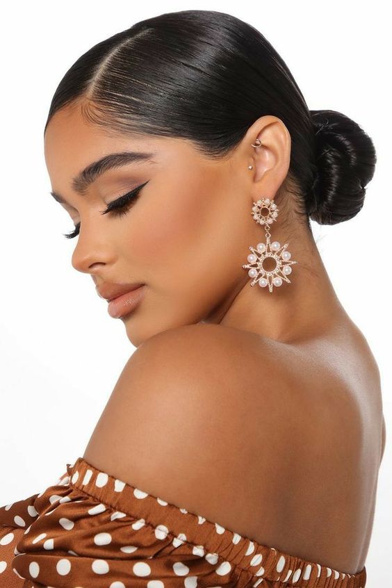Quinceanera beauty Hair Extension, a woman wearing a polka dot top and earrings