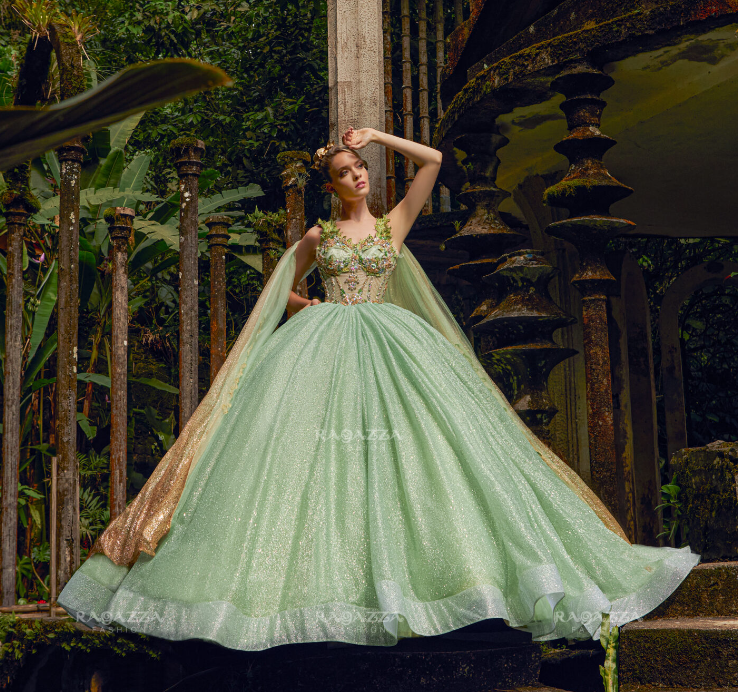 A woman in a green Tinkerbell Quinceanera dress standing on a set of stairs