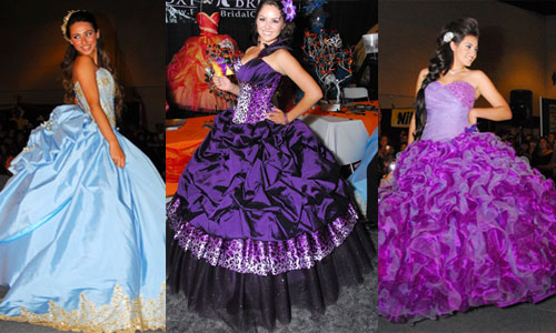 Two women in purple and blue dresses posing in Quinceanera gowns