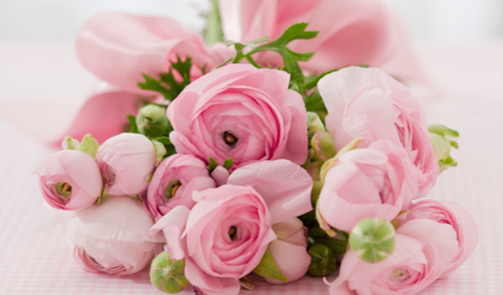 A Quinceanera bouquet of pink flowers on a table
