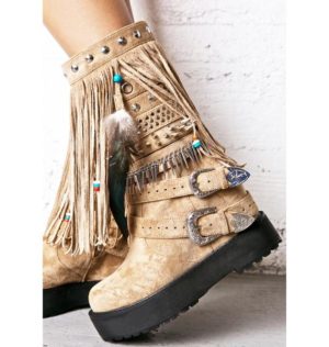 A pair of Quinceanera boots with fringes and feathers on them