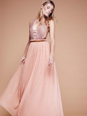 Quinceanera day dress, a woman in a pink dress posing for a picture