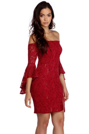 Quinceanera day dress, a woman in a red dress posing for a picture