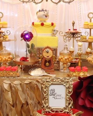 A Quinceanera-themed dessert table with a beauty and the beast birthday theme. Created by Kara's Party Ideas.