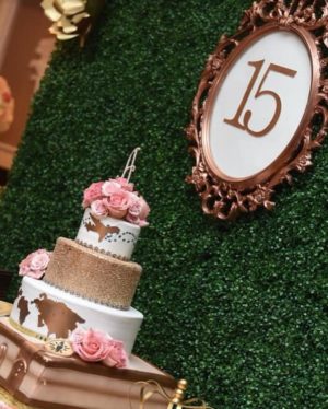 Cake decorating, a table topped with a three-tier Quinceanera cake