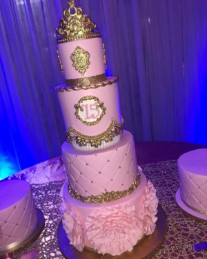 Quinceanera cake, a three tiered cake with a crown on top