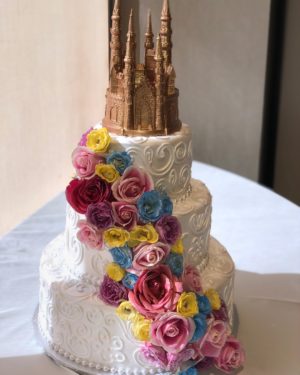 Quinceanera cake, a Quinceanera cake with a castle on top of it