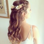 Quinceanera image: A woman with long hair wearing a flower crown on her head