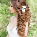 Quinceanera hairstyle, a woman with a flower in her hair