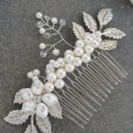 A close up of a pearl jewellery hair comb on a table for a Quinceanera celebration