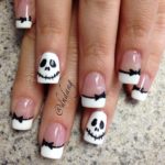 Quinceanera image: Jack Skellington themed nail tips with a person wearing skeleton face design.