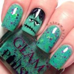 A person holding a green nail polish for Quinceanera inspired fantasy nail art design