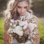 Quinceanera boho jewelry earrings, a woman holding a bouquet of flowers in a field