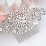 A Quinceanera headpiece Hair Accessory, a close up of a hair comb with flowers in the background.