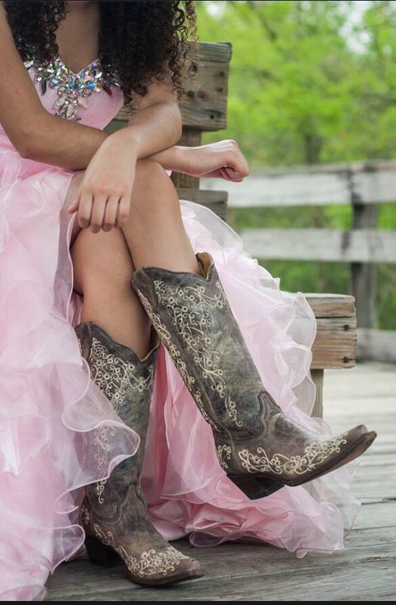 Quinceanera dresses for a sweet 16 cowgirl theme, featuring a woman wearing a pink dress and cowboy boots