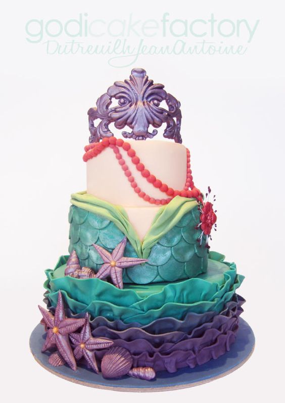 A quinceanera sugar cake, a three tiered cake decorated with purple and green icing