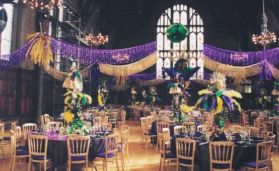 Quinceanera celebration in Mardi Gras style. A large room with tables in New Orleans.