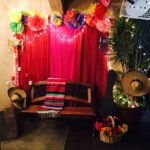 Interior design Quinceanera party with a red curtain and a bench