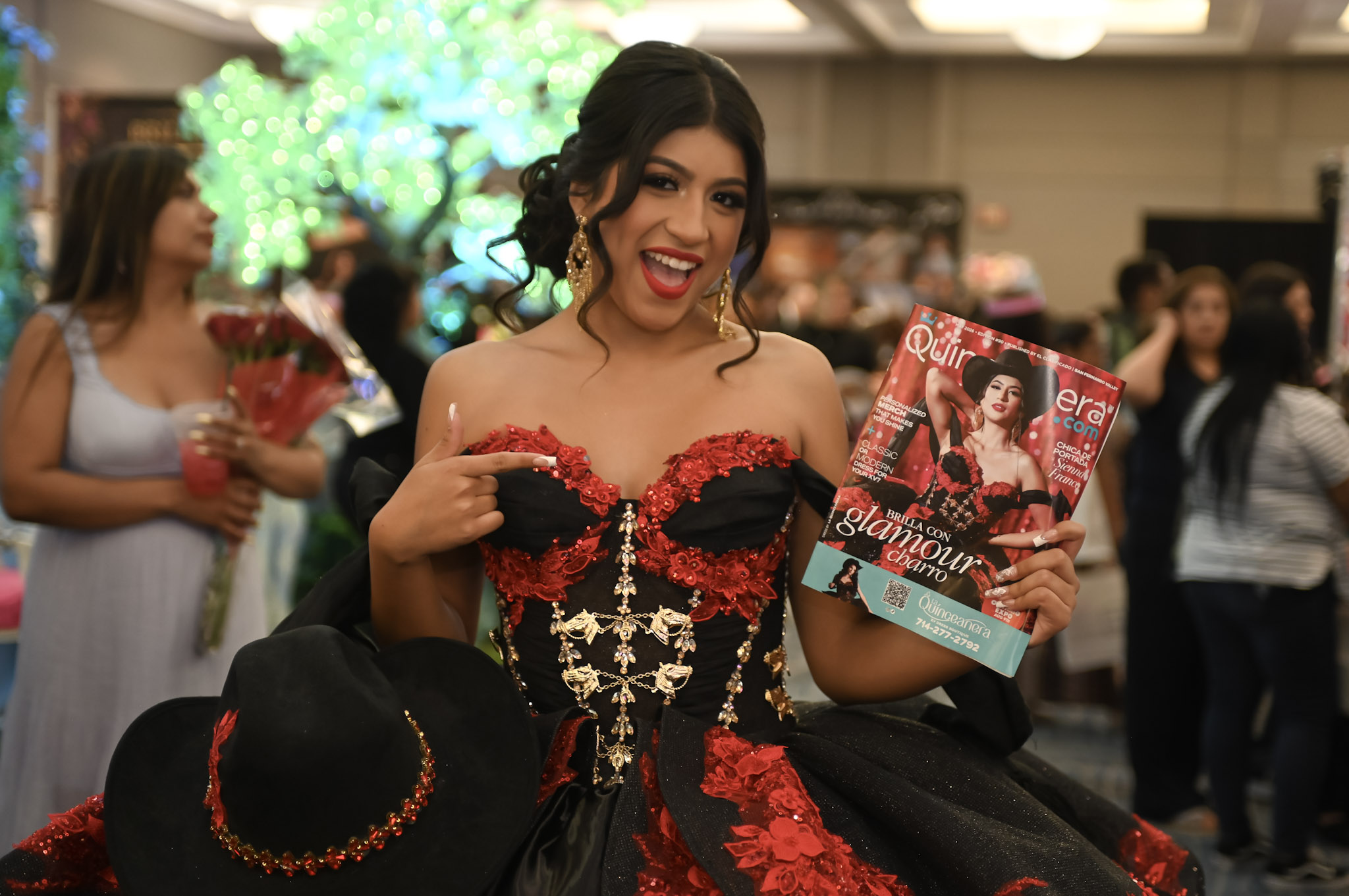 Quinceanera.com Cover Girl holding Magazine
