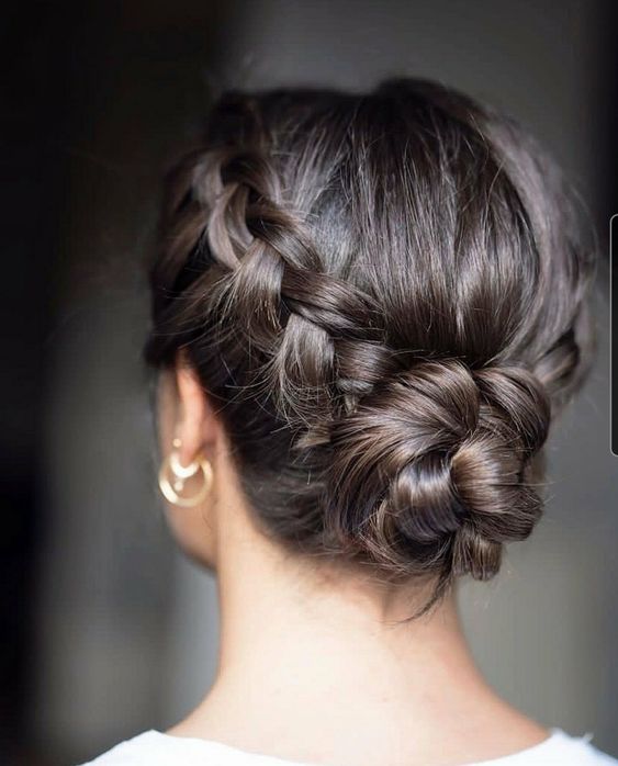 Quinceanera hairstyle, a woman with her hair in a braid bun