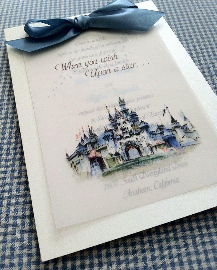 A Disney-themed Quinceañera invite featuring a picture of a castle with a blue ribbon
