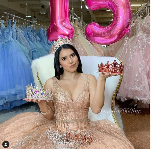 Quinceanera gown, a woman sitting on a chair holding a tiara
