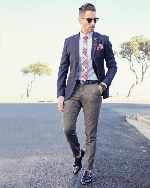 A man in a blazer walking down the street in a suit and tie, Quinceanera