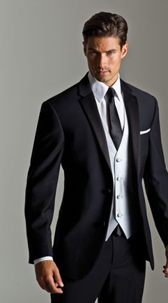 A gentleman in a black suit and white shirt