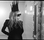 Quinceanera: Lady Gaga, a woman wearing a crown standing in front of a mirror in the song Bad Romance.