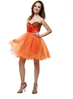 A woman posing for a picture in a Quinceanera cocktail dress, an orange dress.