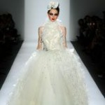 A woman in a Quinceanera gown walking down a runway