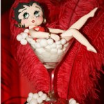 Quinceanera themed image: Betty Boop doll sitting in a martini glass with marshmallows