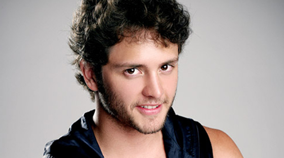 Christopher von Uckermann, a man with curly hair and a leather vest, at the Quinceanera of Dulce Mar&iacute;a e Christopher