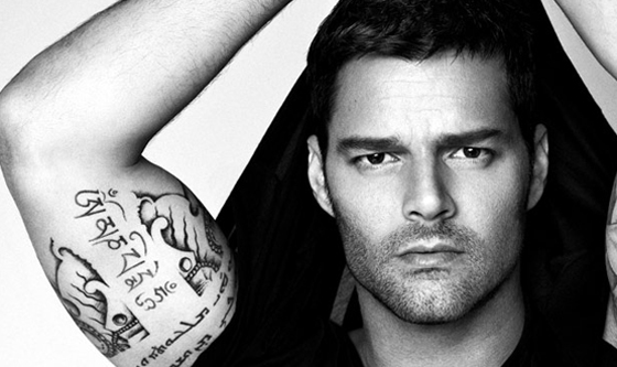 Cute black and white photo of Ricky Martin, a man with tattoos on his arms, in a Quinceanera theme