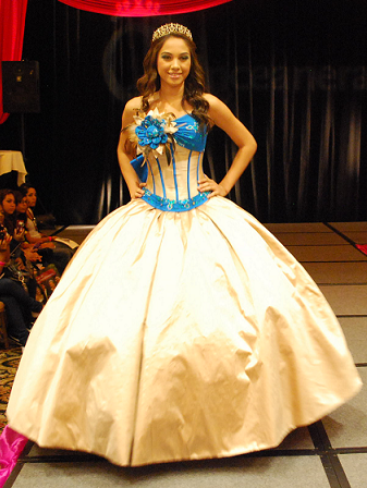 Quinceanera Ball Gown, a woman in a ball gown posing for a picture