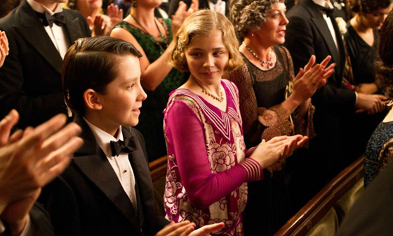 Chloe Grace Moretz in Hugo Chloë Grace Moretz and a group of people standing in front of a crowd at a Quinceanera celebration