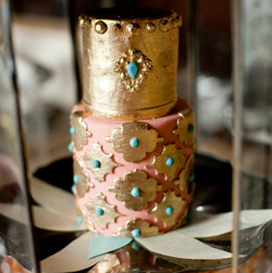 Quinceanera ceremony supply Cake, a gold and pink cake sitting on top of a table