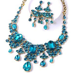 A Quinceanera necklace and earring set with blue stones