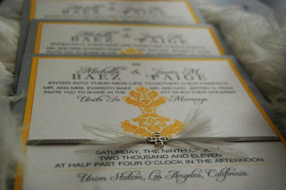 Quinceanera: A close up of a yellow Quinceanera invitation on a table