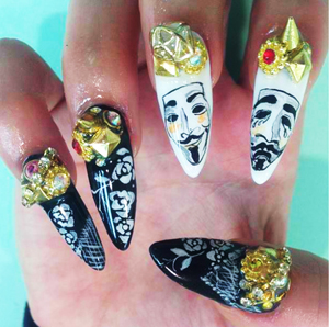A person holding a pair of fake nails for a Quinceanera event.