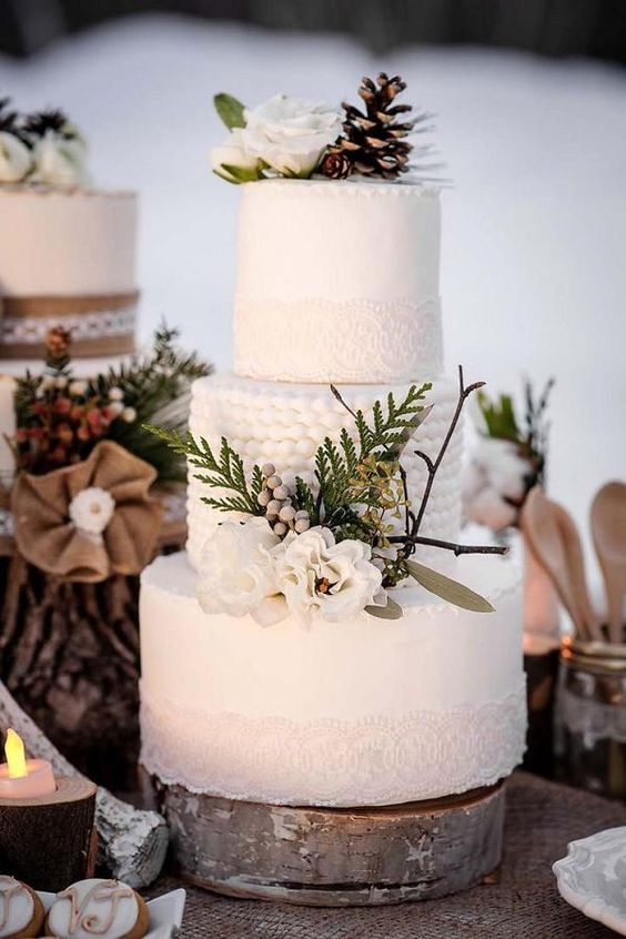 Quinceanera cake, a white cake decorated with pine cones and flowers