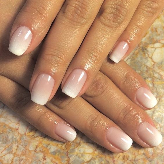 Close up of Quinceanera's nails with a white and pink ombre manicure