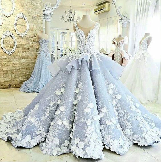 A princess Quinceanera dress in vibrant colors on display in a store