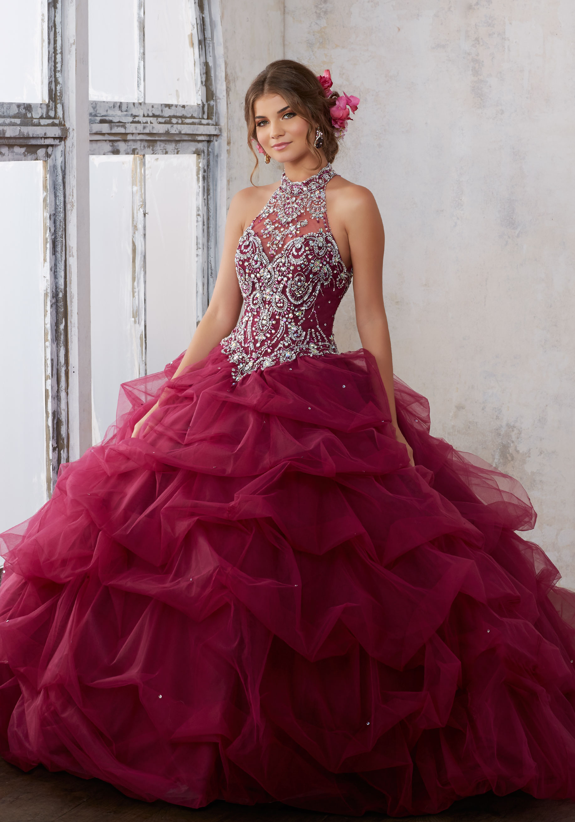 Types of Quinceañera dresses, a woman in a red dress posing for a picture