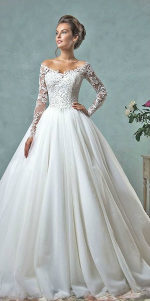A woman in a Quinceanera dress posing for the camera