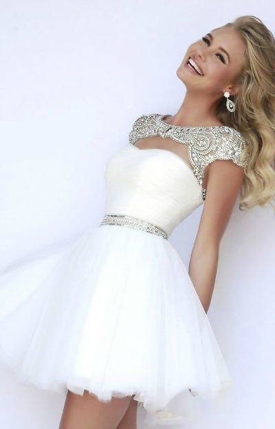 Short white Quinceañera dresses, a woman in a white dress posing for a picture