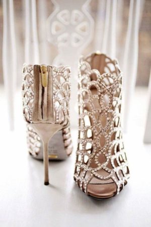 A close up of a pair of Bridal Shoes on a table, perfect for a Quinceanera celebration.