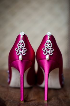 Close up of a pair of high-heeled shoes with pearls, perfect for a Quinceanera event.