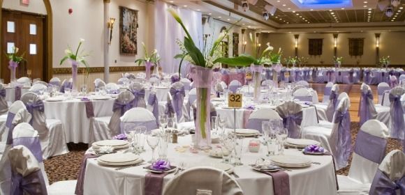 Venue with white & purple tables