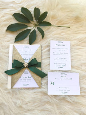 Quinceanera invitation with a green ribbon and a bow